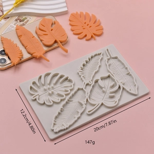 Silicone leaf fondant mold featuring monstera and banana leaves for cake decorating
