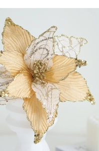 Close-up of champagne gold artificial Poinsettia flower with glitter for Christmas trees