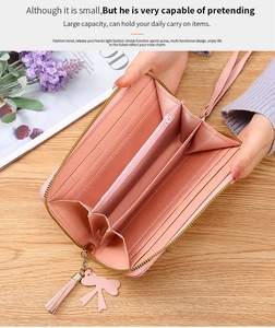 Internal view of pink long wallet showing multiple card slots and large capacity
