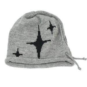 Detail of dark grey knit beanie featuring black star embroidery and side drawstring