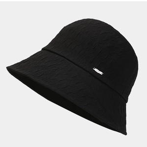 Minimalist black sun hat with textured fabric and metallic logo detail for summer