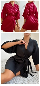 Detail of silk satin robes featuring elegant v-neckline, waist tie, and decorative tassels