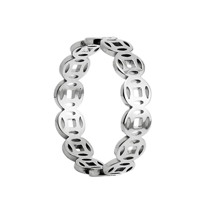 Detailed macro shot of vintage silver steel ring with traditional Chinese coin pattern