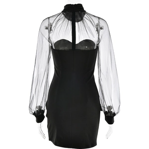 Detail view of the black mesh patchwork dress back featuring a hidden zipper closure