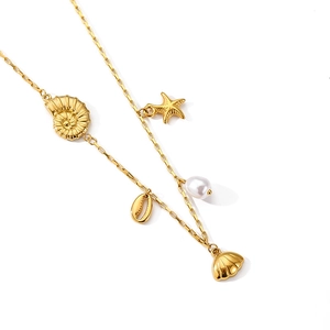 Detailed shot of golden square-link necklace featuring starfish, shell, and pearl charms