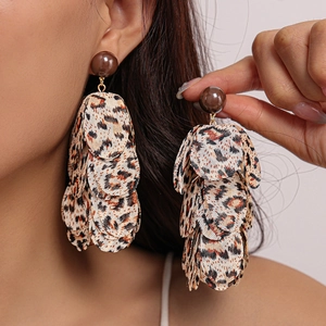Chiffon leopard print petal fringe earrings worn by a model for a stylish vintage look
