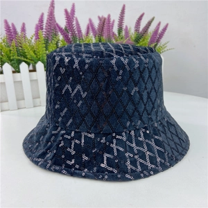 Detail view of the navy velvet bucket hat featuring black sequin diamond patterns