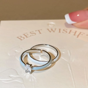 Two-piece set of adjustable silver rings with light blue and white enamel and zircon