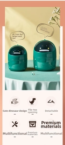 Macro detail of cute green dinosaur desktop trash bins in large and small sizes