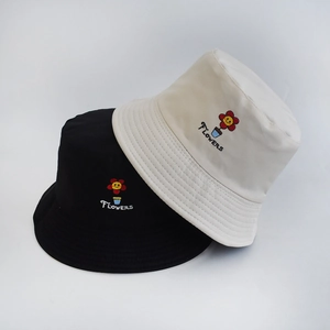 Detailed close-up of fruit floral embroidery on reversible outdoor cotton bucket hats