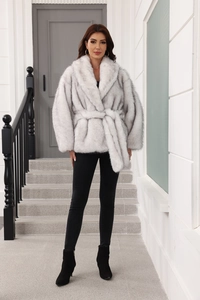 Detail of light gray faux fur coat featuring a soft texture and matching waist belt