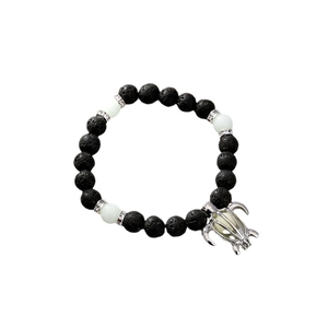Luminous turtle charm bracelet with black lava stone beads and glowing accents