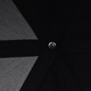 Top detail of baseball cap showing black twill fabric and grey mesh with metal rivet