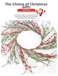 Detailed top view of a festive red berry and green leaf Christmas wreath on white fur