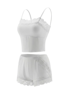 Detailed close-up of white lace trim on a minimalist two-piece lingerie set for women