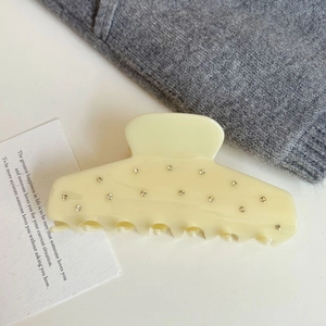 Elegant cream beige acetate shark hair claw clip with shimmering rhinestones detail