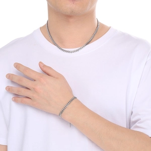 Unisex silver stainless steel wheat chain necklace and bracelet set on model