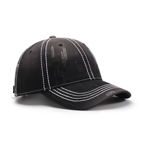 Distressed black cotton baseball cap with vintage worn details and white contrast stitching