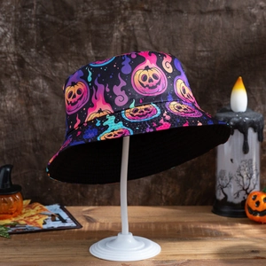 Detail of Halloween bucket hat featuring colorful pumpkin and ghost prints in a festive setting