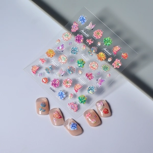 3D embossed nail stickers featuring colorful floral and succulent patterns with butterfly decals