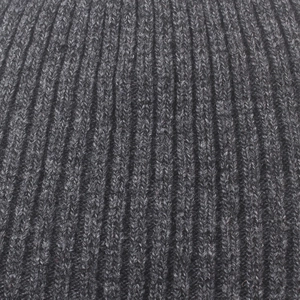 Macro shot of charcoal grey rib knit wool fabric showing fine texture and warmth
