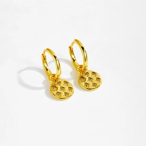 Detailed view of gold S925 sterling silver hoop earrings with textured zircon pendants