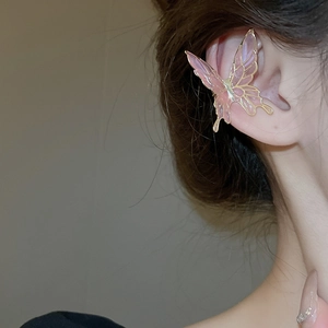 Detailed view of elegant gold butterfly ear cuff with pink translucent resin wings