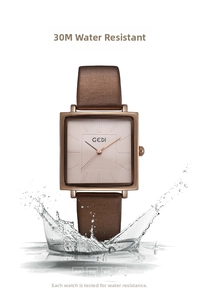 Detail showing 3ATM life waterproof feature on square rose gold leather watch