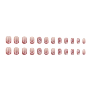 Faux ongles dégradés roses avec motifs fleurs de cerisier blancs et détails de perles