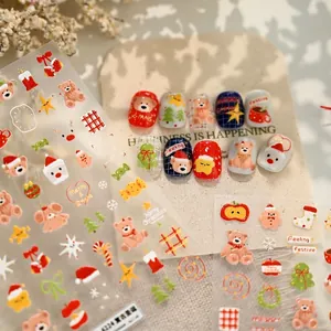 3D embossed Christmas bear nail stickers featuring Santa and festive tree designs