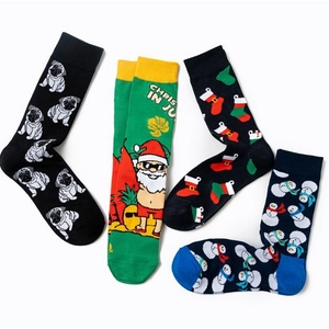 Cotton Christmas socks with cute dog and snowman patterns in a flat lay display