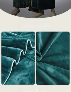 Close-up of thick dark green flannel bathrobe fabric with white piping detail