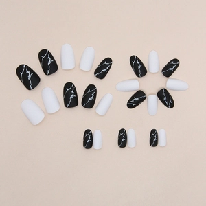 Matte black marble and white oval press-on nails set with almond shape design