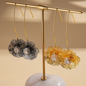 Elegant 18K gold plated hollow floral hook earrings with cubic zirconia on display