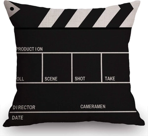 Detail of linen pillowcase featuring a black movie clapperboard periodic table print