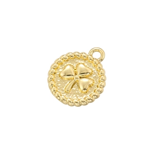 Detailed close-up of a golden lucky four-leaf clover pendant with polished metallic luster