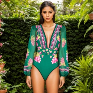 Deep V-neck long sleeve one-piece swimsuit with tropical floral print and matching belt