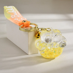 Creative cat paw liquid glitter keychain with orange Bubble strap and golden bell charm