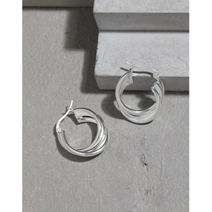 Minimalist S925 sterling silver multi-layer hoop earrings on a stone textured surface