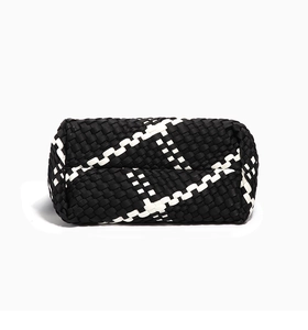 Detailed view of the black and white cross-woven leather pattern on this stylish tote bag