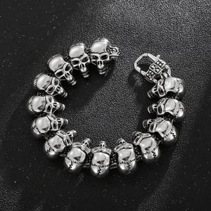 Detailed view of hip hop skull head stainless steel bracelet on a black background