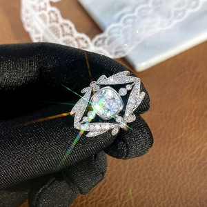 Elegant crown ring with square main stone and leaf-shaped side diamonds in silver finish