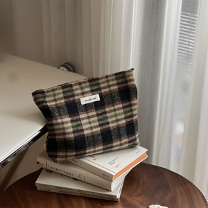 Detail of vintage plaid tweed makeup bag with zipper and Simple Wish woven label