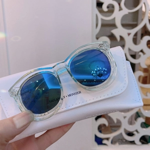 Kids' transparent cat-eye sunglasses with blue mirrored lenses and a white leather case