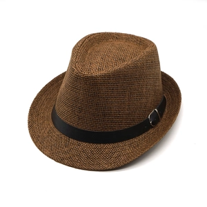 Classic brown straw Fedora hat with black leather band and metal buckle on white background