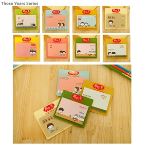 Close-up of cute cartoon animal sticky notes in various colors on wooden desk