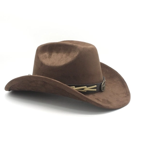 Detail of dark brown cowboy hat with leather band and bronze bull head ornament