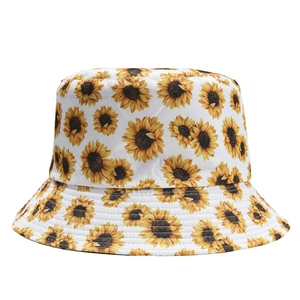 Detail of white cotton bucket hat featuring dense sunflower floral print pattern