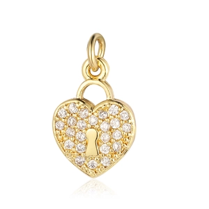 Macro shot of gold heart lock pendant with sparkling zircon micro-pave and keyhole
