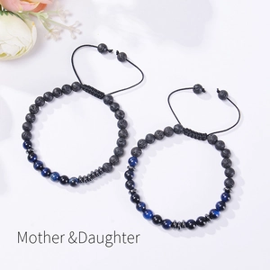 Detail of Mother & Daughter Morse code bracelets with black lava stone and tiger eye beads